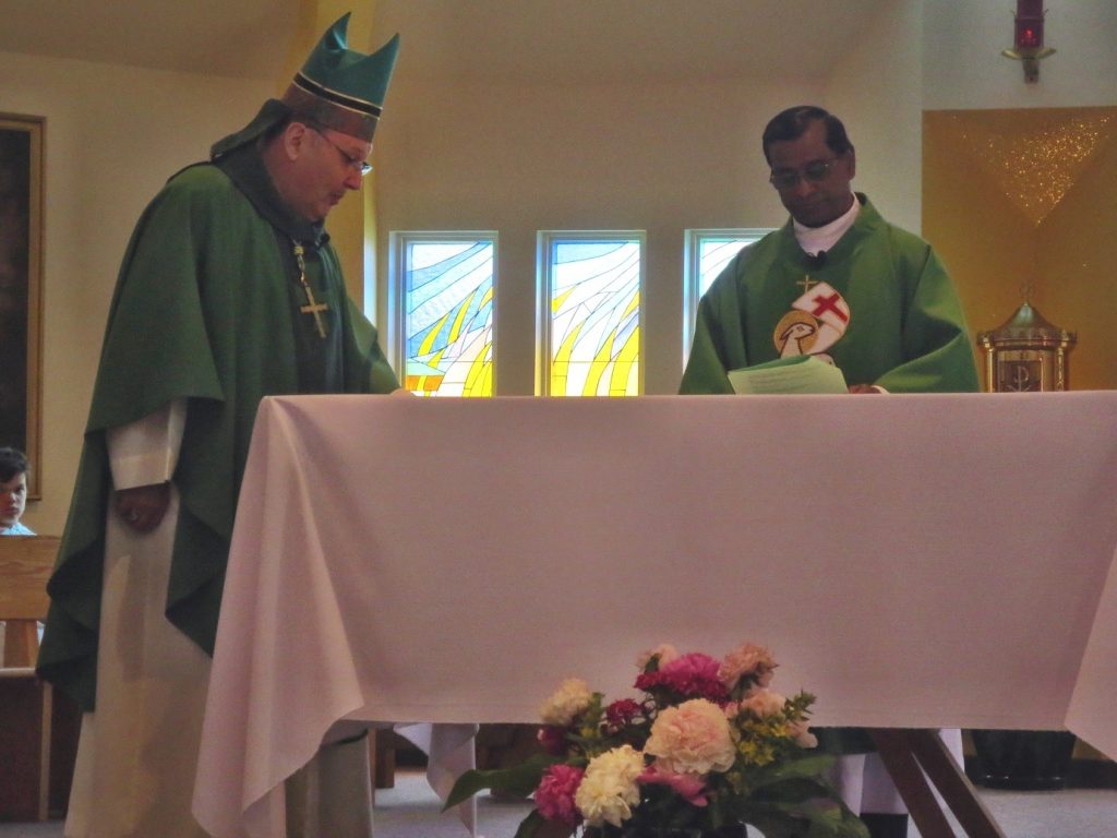 At the Altar where the people will be fed with the Bread of Life.
