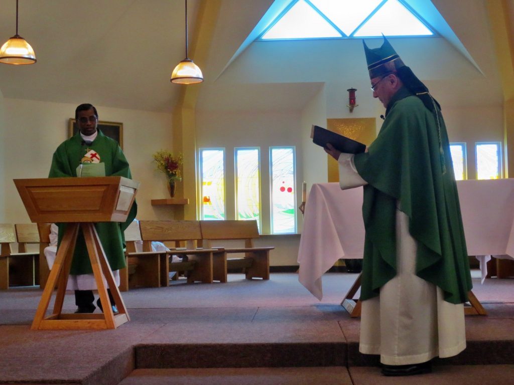 At the Ambo where the Word of God is Proclaimed and the Faithful are encouraged by the Gospel.