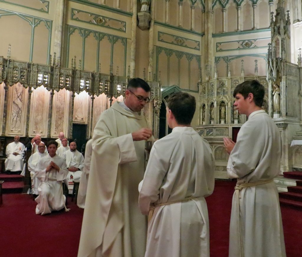 Fr. Handrahan distributes the Eucharist for the first time as a Priest.